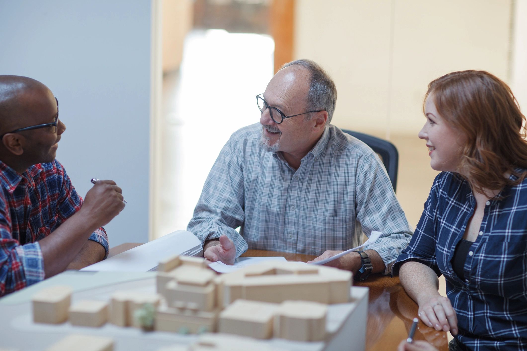 Team reviewing plans during a collaborative planning meeting